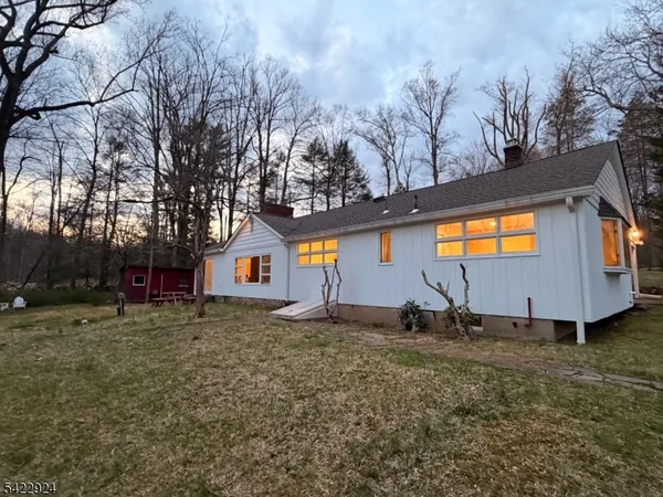 a backyard of a house with shaded area