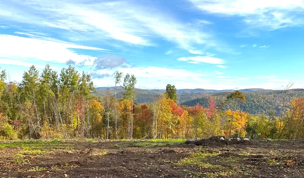 a view of mountain with sunset