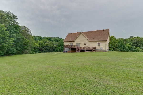 4664 New Cut Road Greenbrier, TN 37073 - Photo 78 of 85 a front view of a house with a yard and trees