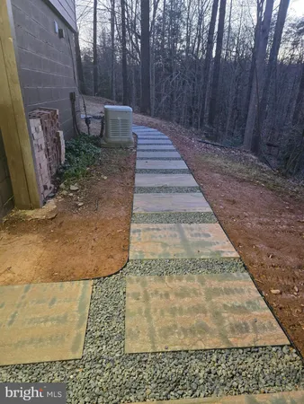 a view of a backyard of the house