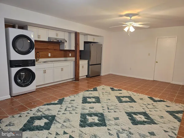 a bedroom with a bed and cabinets