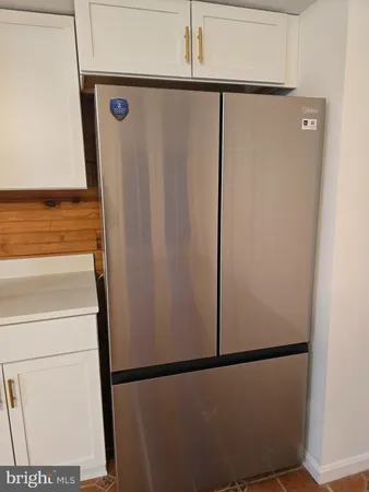 a view of a storage and utility room with washer and dryer