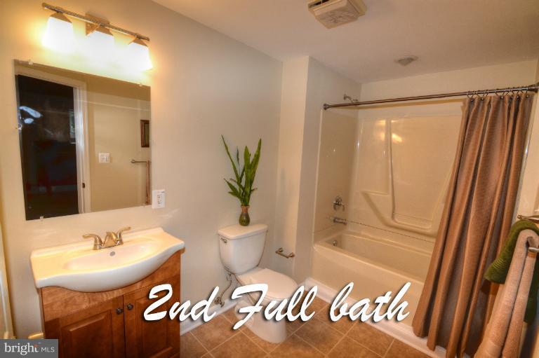 1302 Gransay Road Rosedale, MD 21237 - Photo 13 of 30 a bathroom with a sink toilet and shower