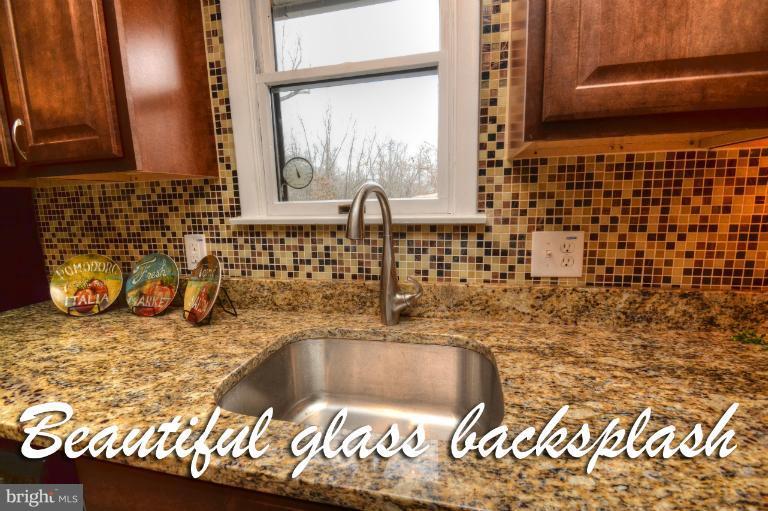 1302 Gransay Road Rosedale, MD 21237 - Photo 3 of 30 a bathroom with a sink and a bathtub