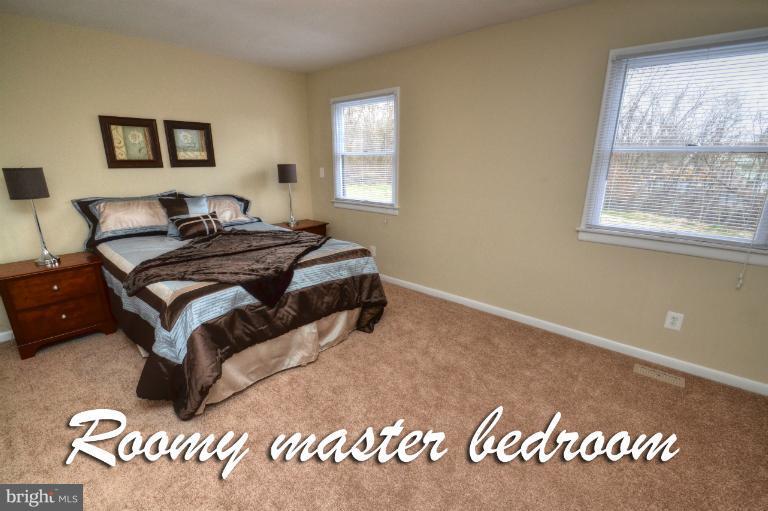 1302 Gransay Road Rosedale, MD 21237 - Photo 23 of 30 a bedroom with a bed and window