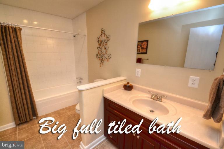 1302 Gransay Road Rosedale, MD 21237 - Photo 10 of 30 a bathroom with a sink and a mirror