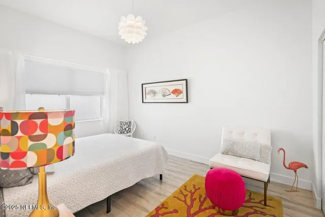 a front view of house with yard and trees in the background