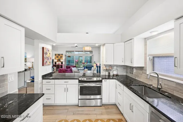 a view of a bedroom with a table and chairs