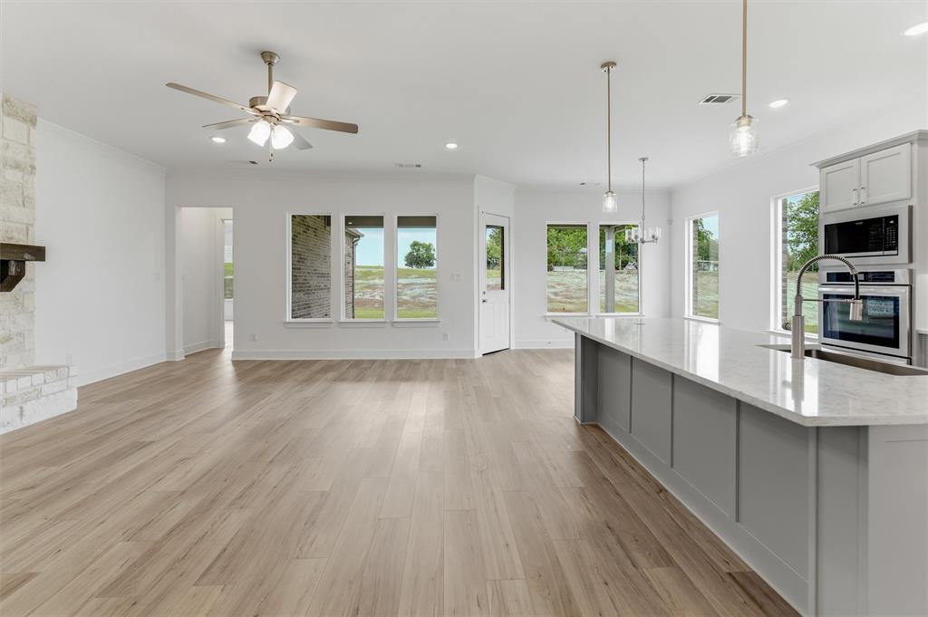 906 Perrin Lane Van Alstyne, TX 75495 - Photo 11 of 30 a view of kitchen with sink and wooden floor