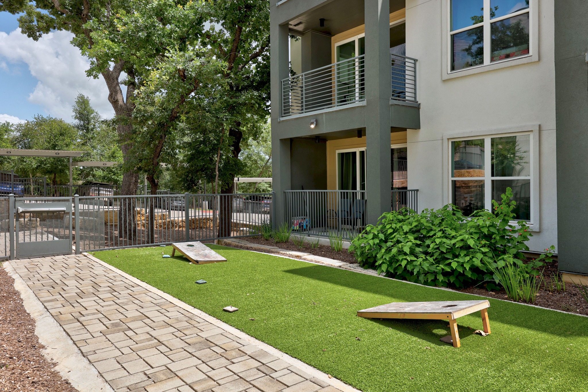 4801 Springdale Road, Unit 2301 Austin, TX 78723 - Photo 29 of 36 Green space for recreation with outdoor amenities and a paved walkway.