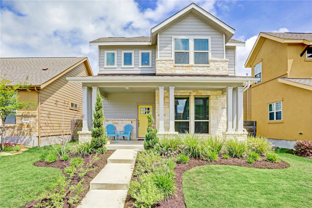 front view of a house with a yard