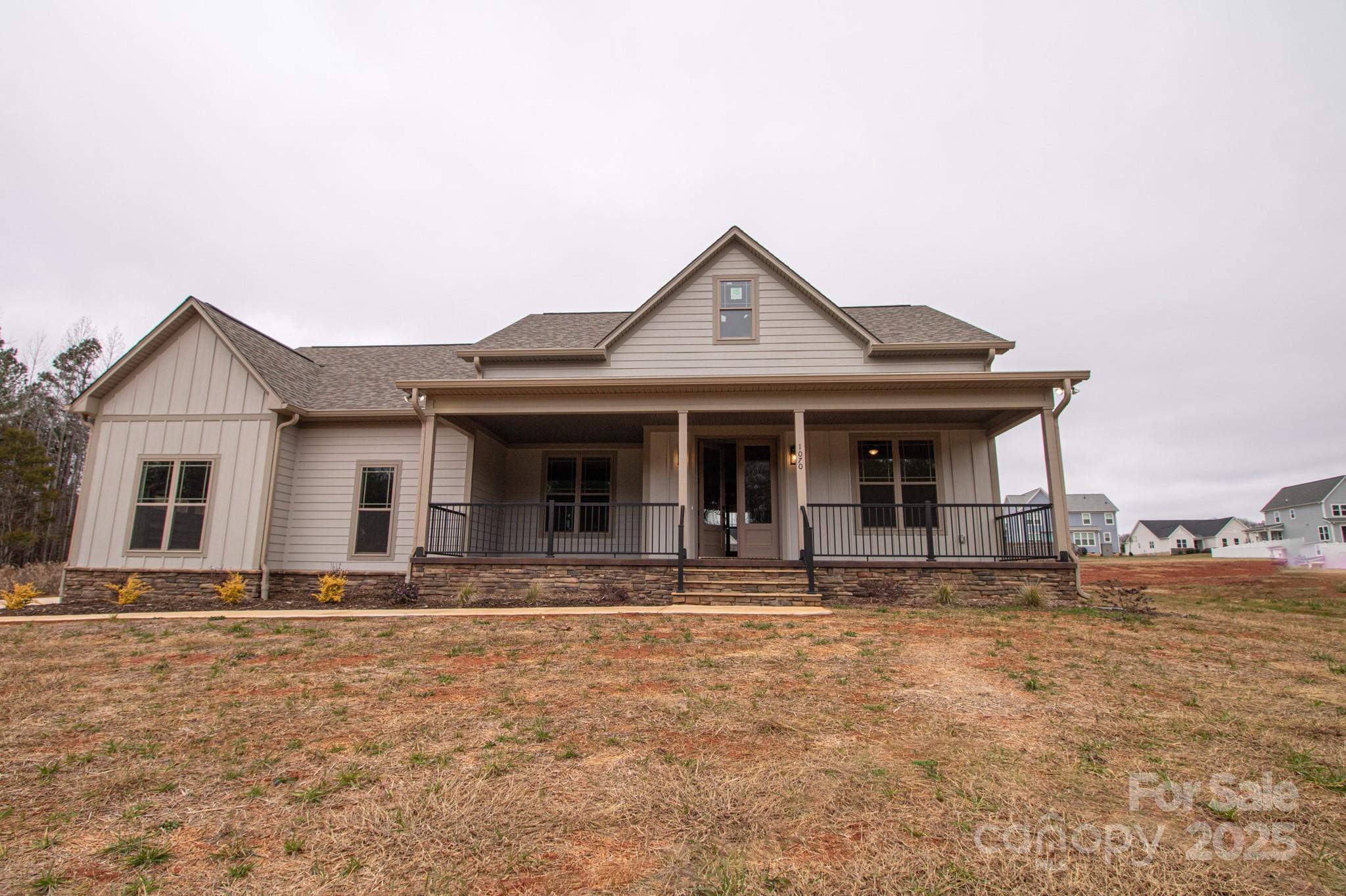 1070 Castle Ml Lane Salisbury, NC 28147 - Photo 1 of 38 a front view of a house with garden