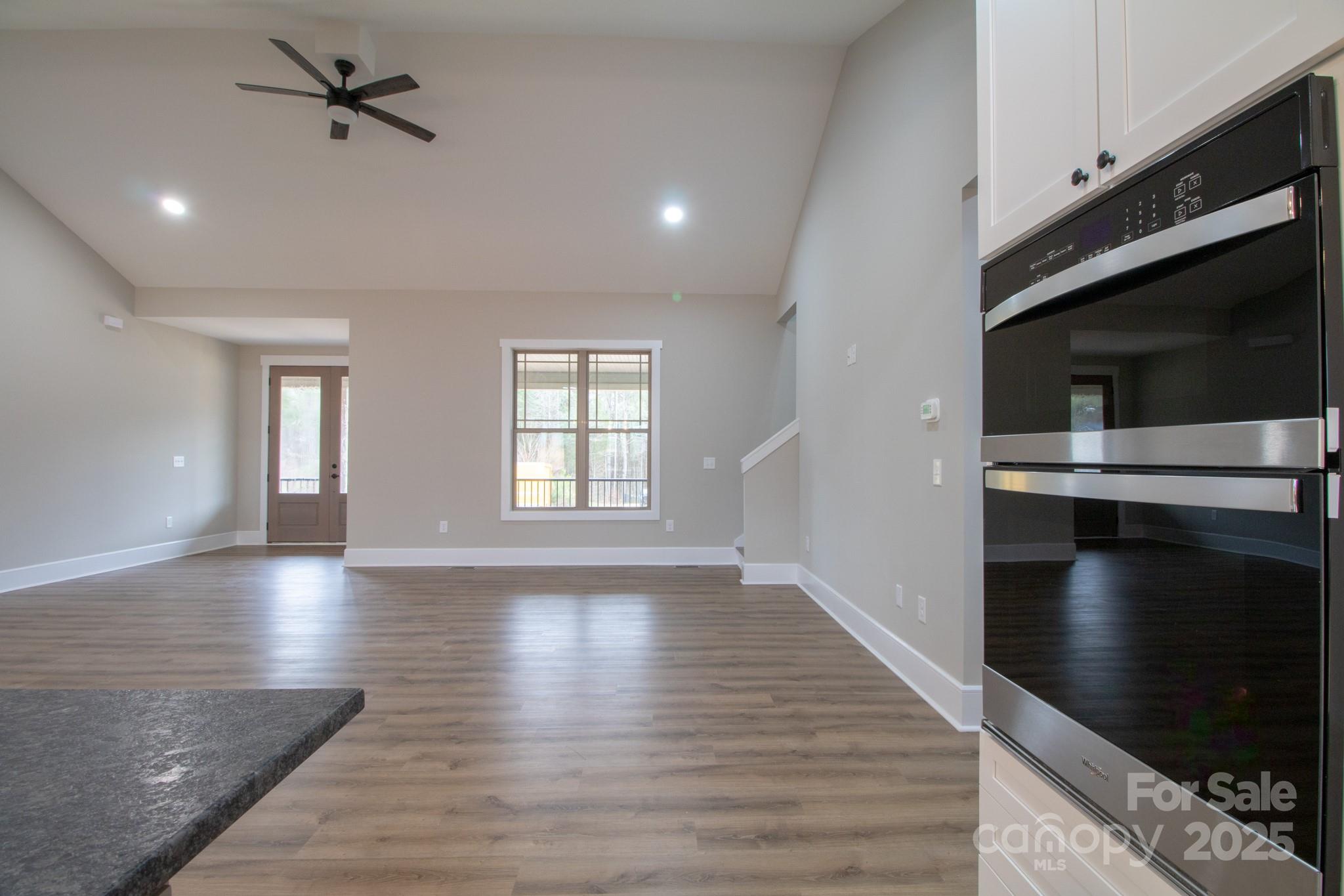 1070 Castle Ml Lane Salisbury, NC 28147 - Photo 11 of 38 a view of an empty room with a fireplace and a window