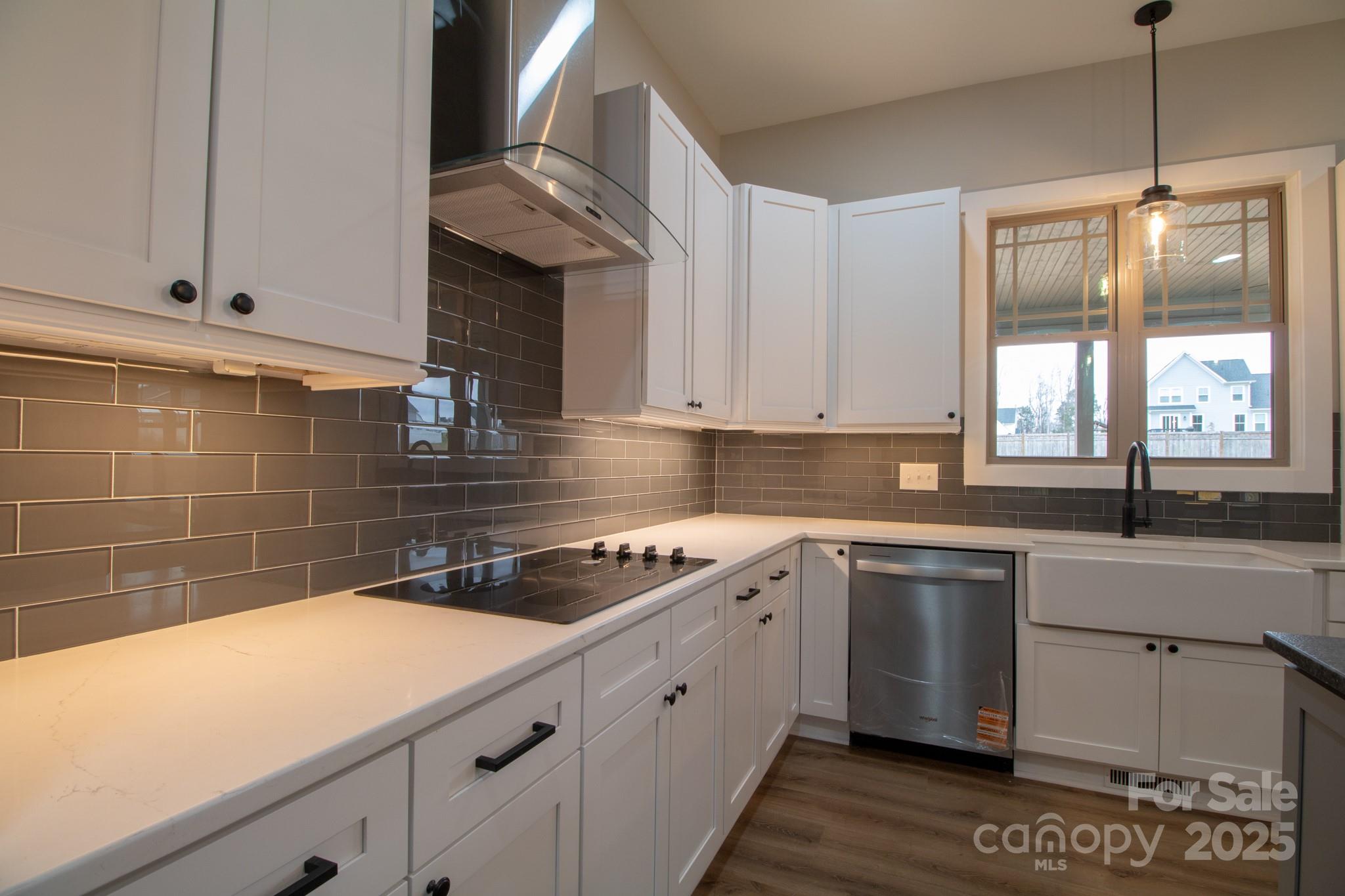 1070 Castle Ml Lane Salisbury, NC 28147 - Photo 12 of 38 a kitchen with a sink stove and cabinets
