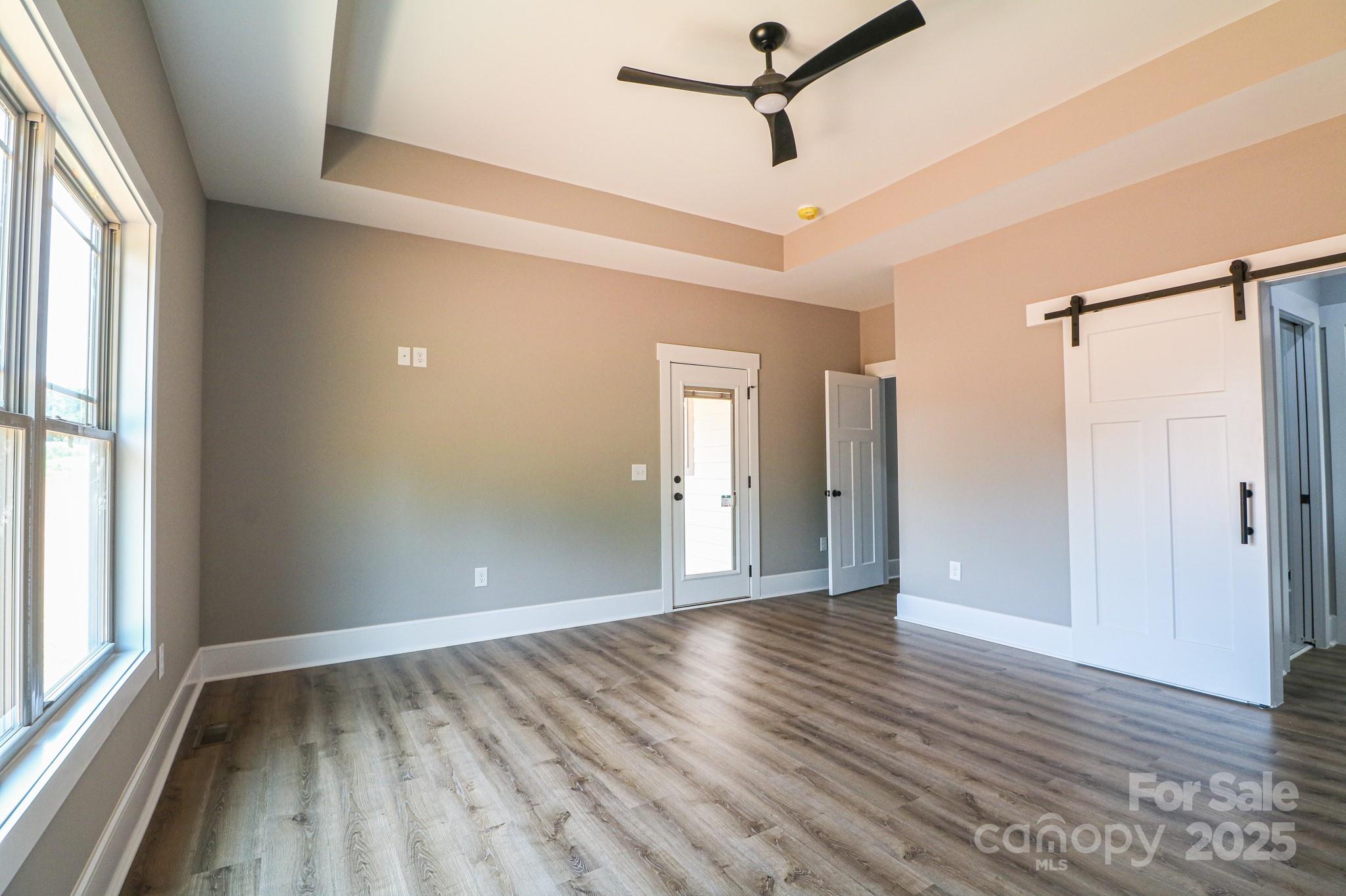 1070 Castle Ml Lane Salisbury, NC 28147 - Photo 16 of 38 a view of an empty room with wooden floor and a window