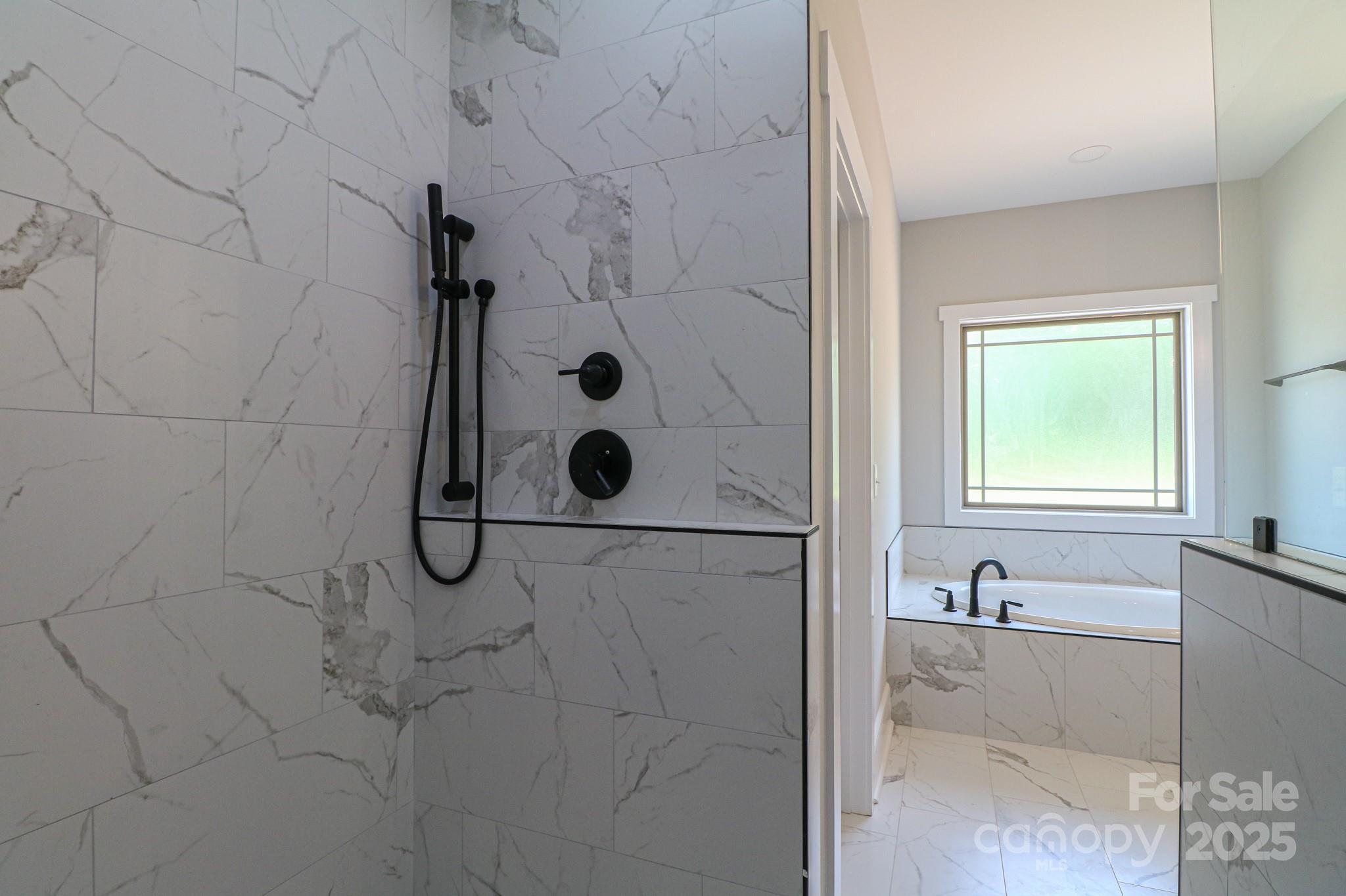 1070 Castle Ml Lane Salisbury, NC 28147 - Photo 22 of 38 a bathroom with a bathtub and shower