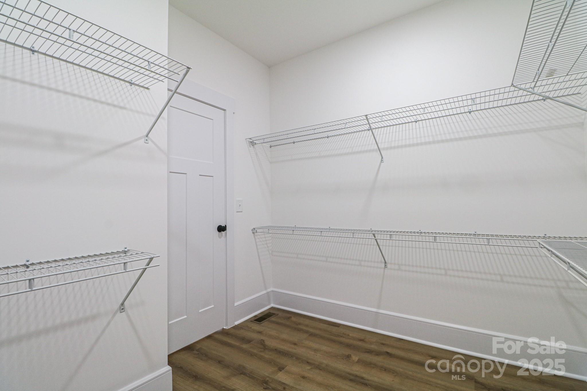 1070 Castle Ml Lane Salisbury, NC 28147 - Photo 23 of 38 a view of a room with racks on the wall