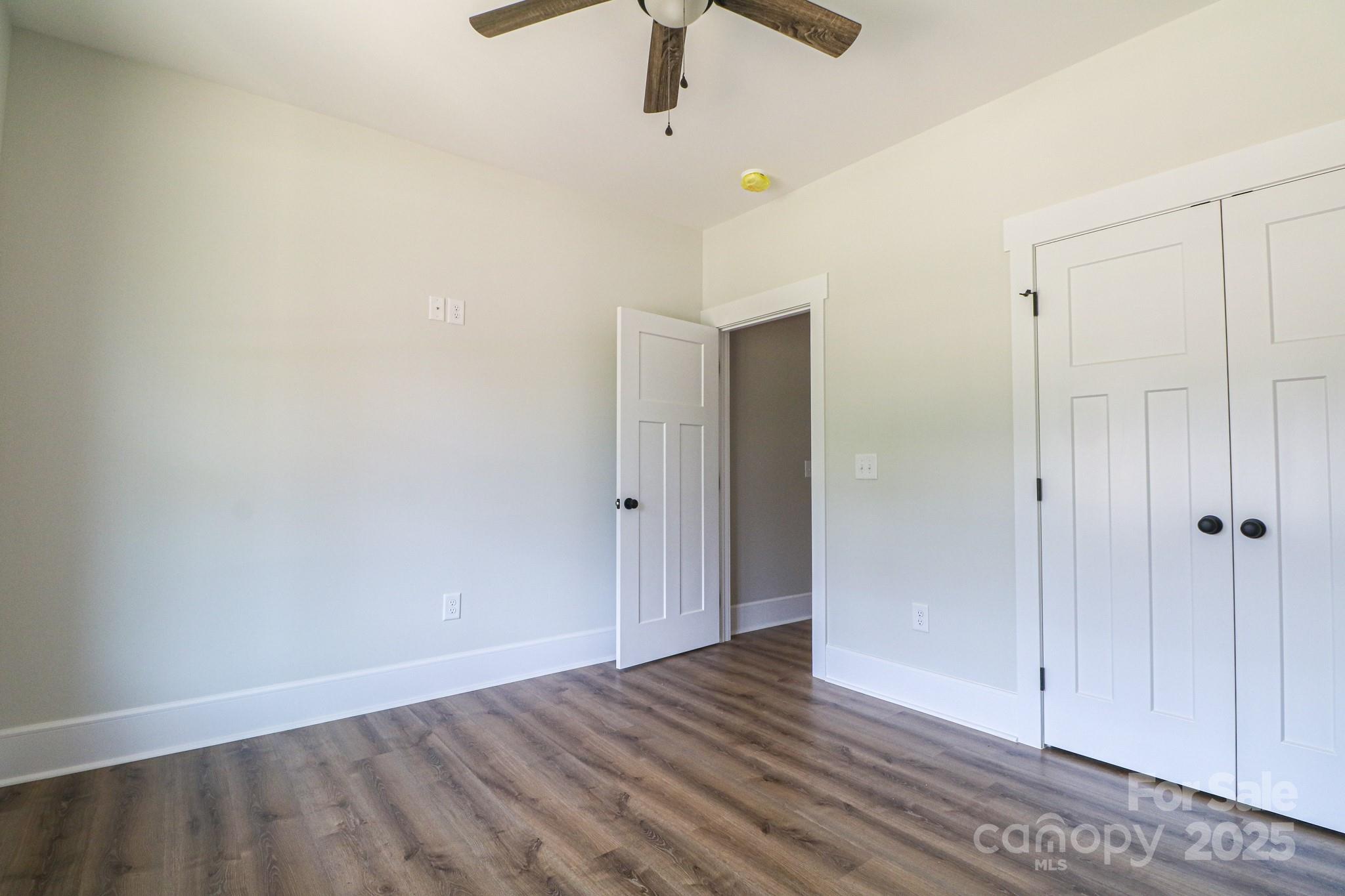 1070 Castle Ml Lane Salisbury, NC 28147 - Photo 26 of 38 a view of an empty room with wooden floor