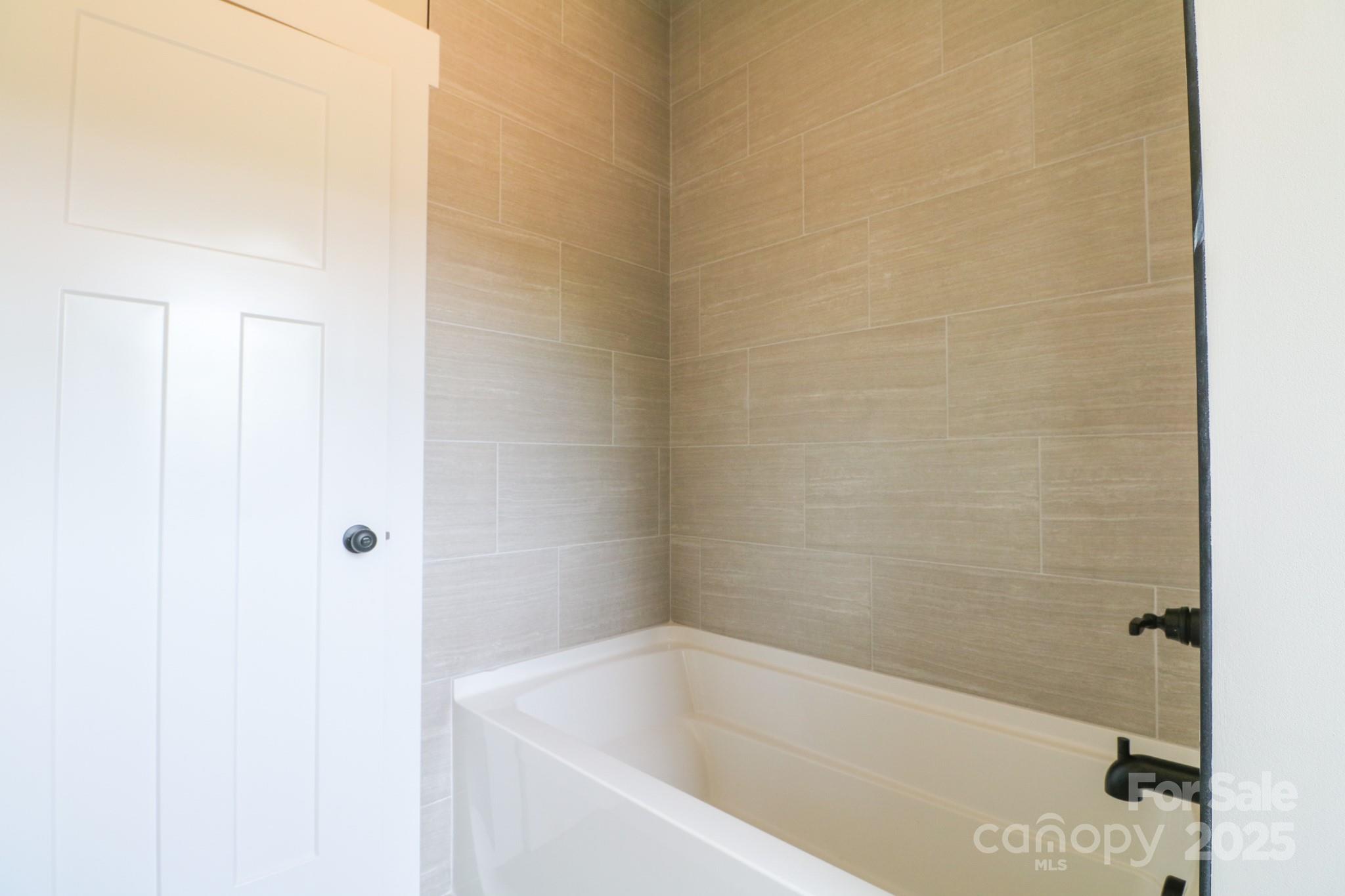 1070 Castle Ml Lane Salisbury, NC 28147 - Photo 29 of 38 a bathroom with a bathtub