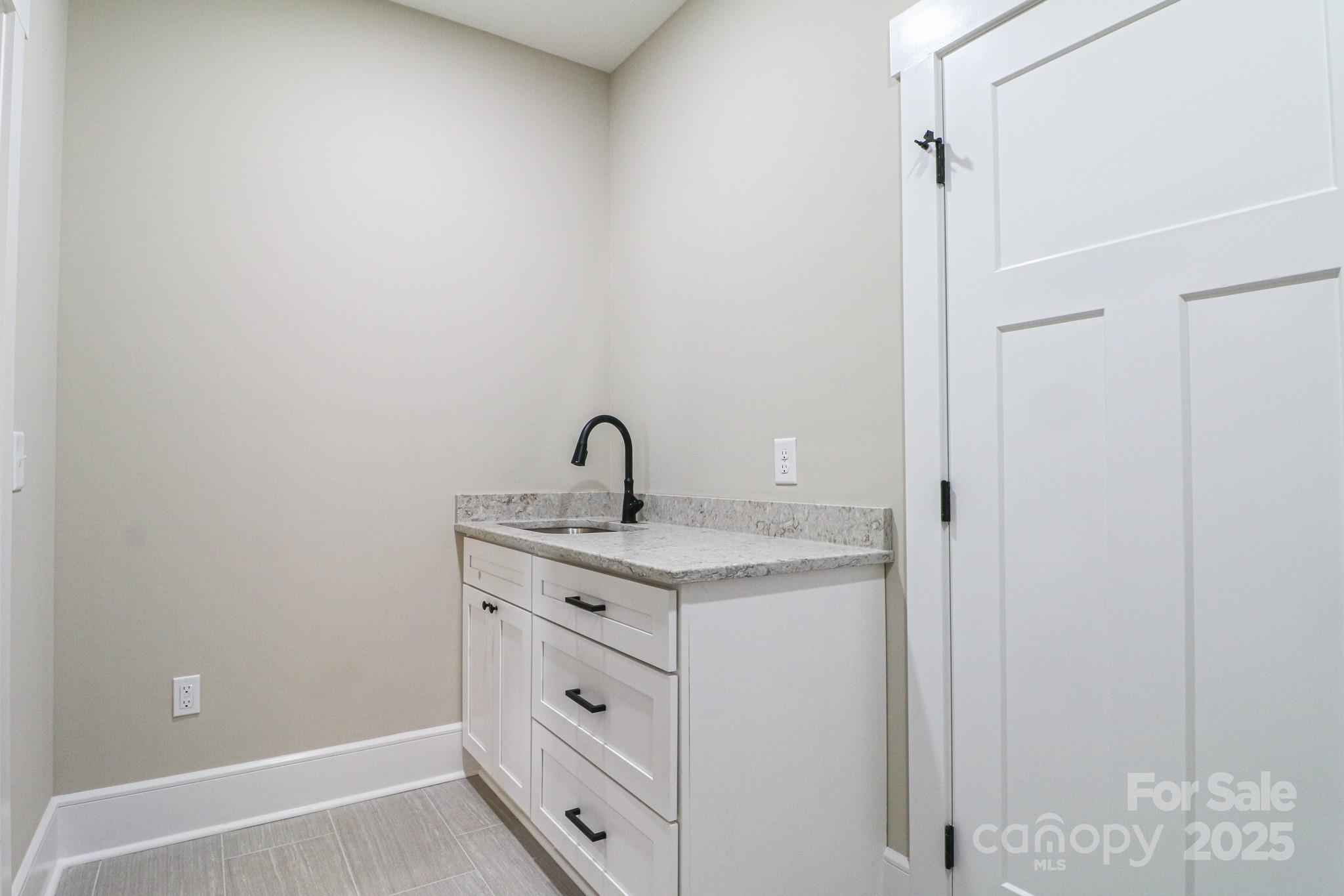 1070 Castle Ml Lane Salisbury, NC 28147 - Photo 30 of 38 a view of a bathroom with a sink and vanity