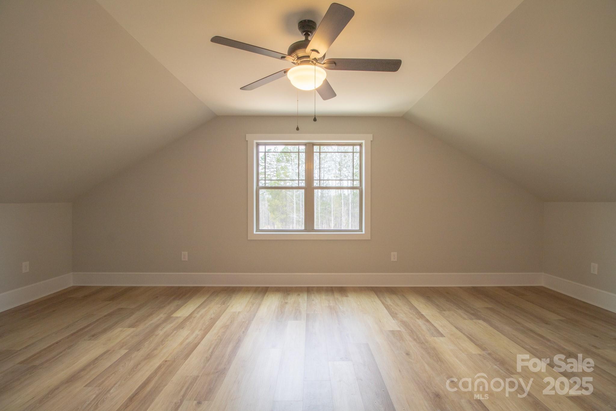 1070 Castle Ml Lane Salisbury, NC 28147 - Photo 32 of 38 an empty room with wooden floor and windows