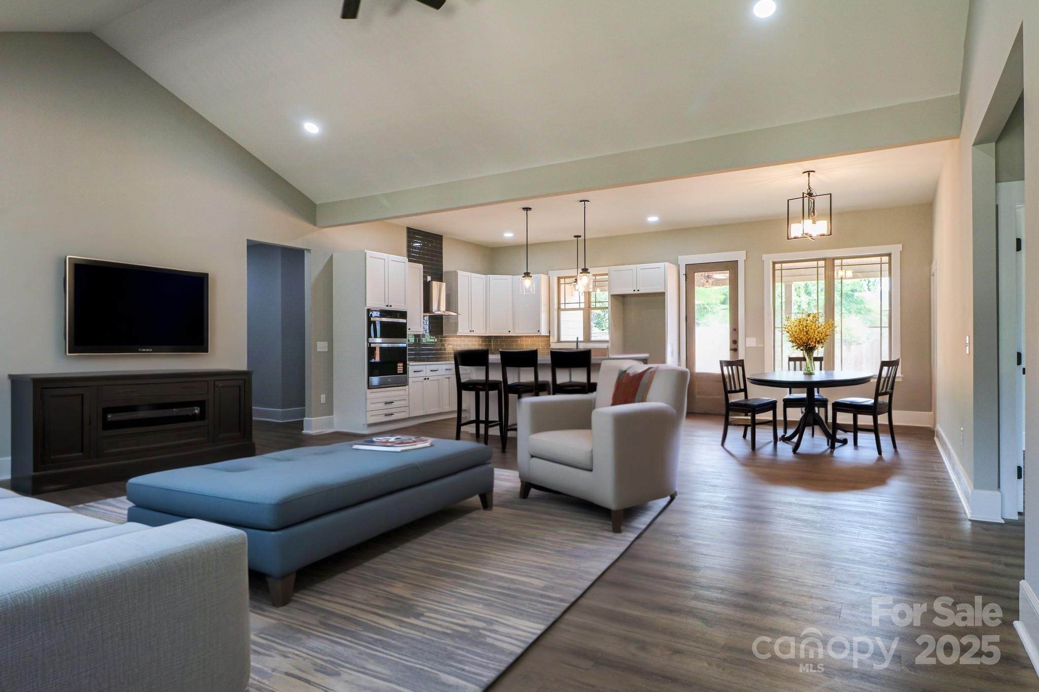 1070 Castle Ml Lane Salisbury, NC 28147 - Photo 4 of 38 a living room with furniture and a flat screen tv