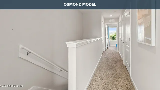 a view of a hallway with white walls