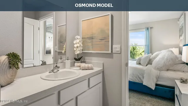 a en suite bathroom with a sink and a mirror