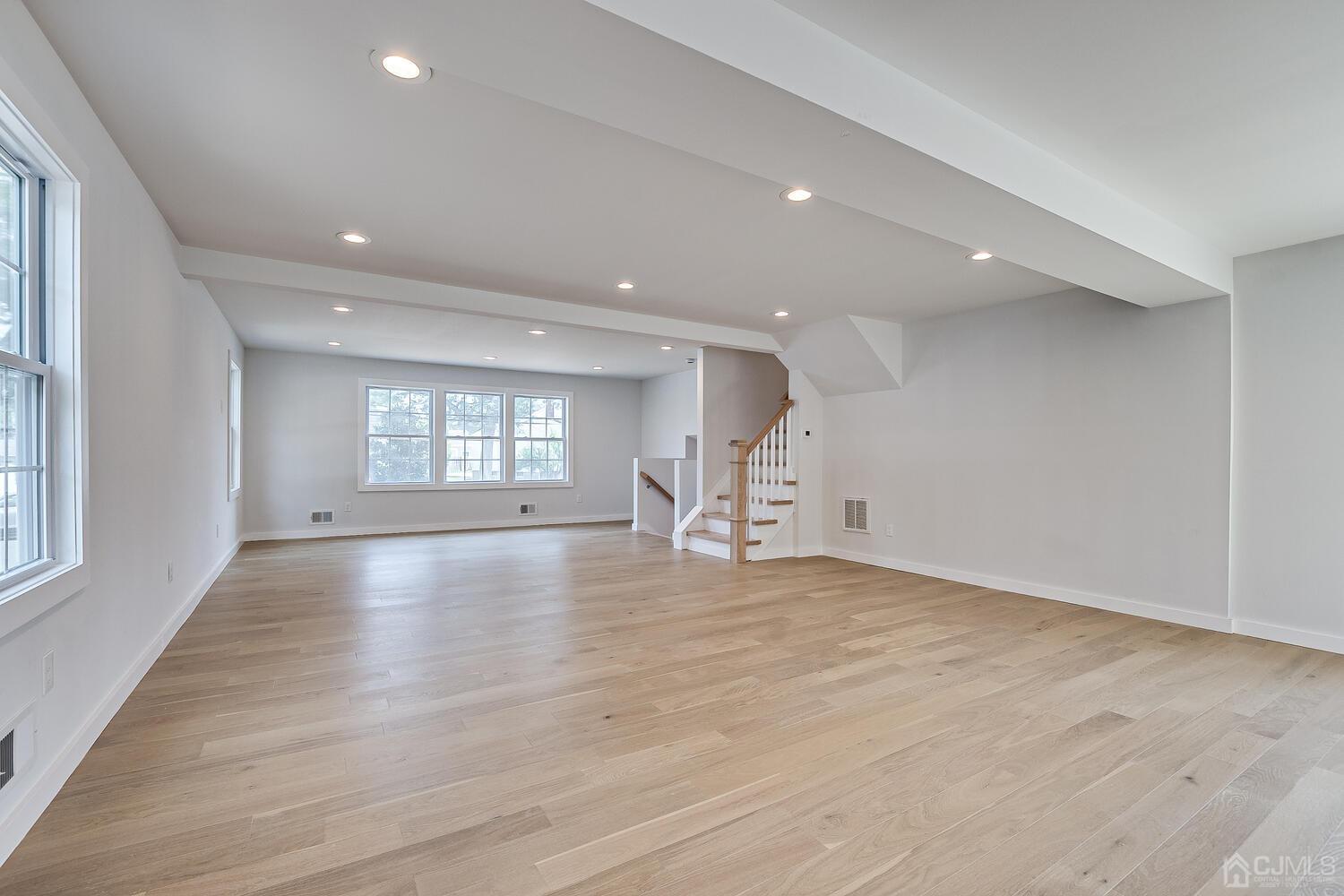 21 Brian Road Edison, NJ 08817 - Photo 17 of 47 an empty room with wooden floor and windows