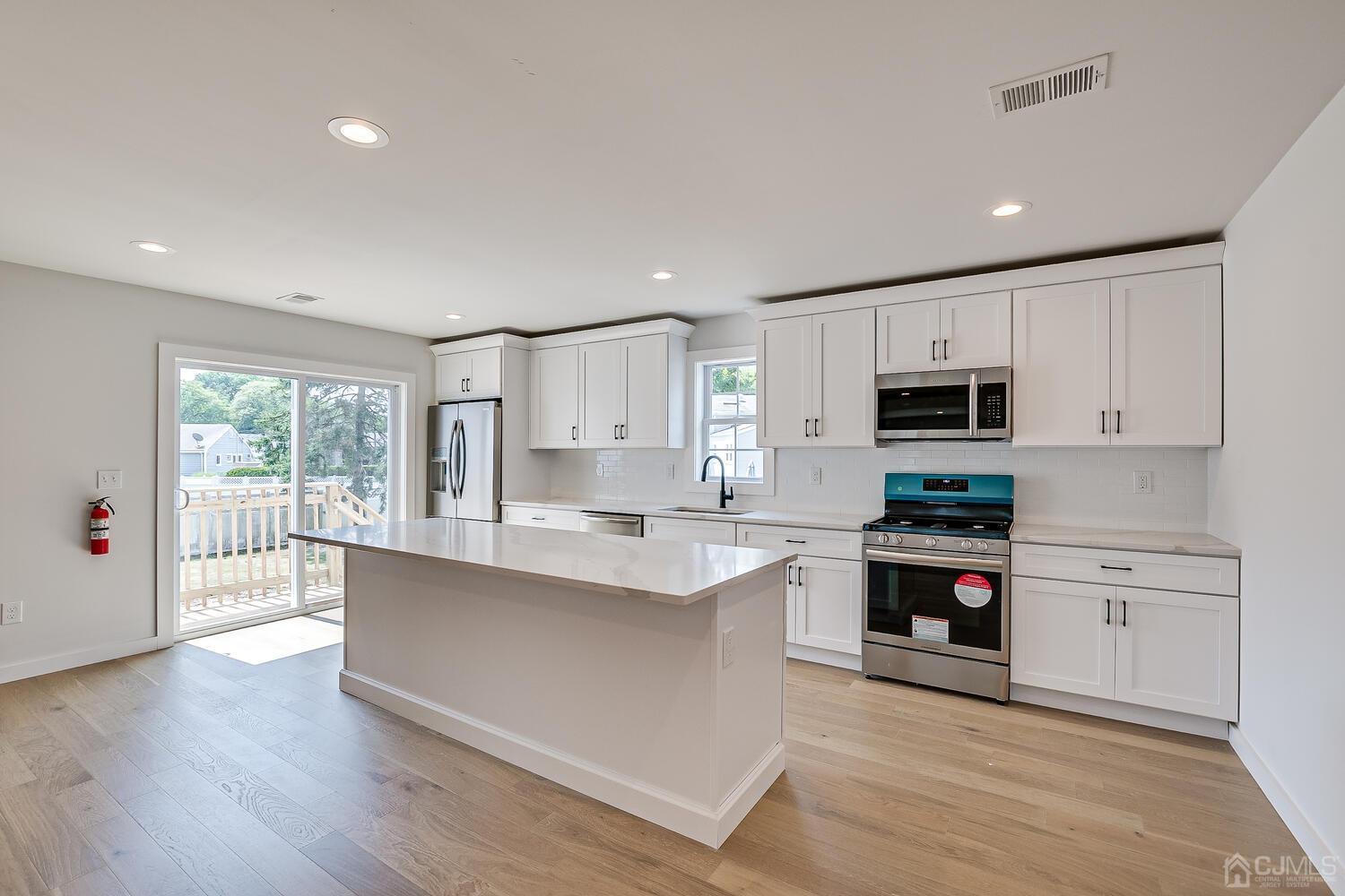 21 Brian Road Edison, NJ 08817 - Photo 18 of 47 a large kitchen with cabinets