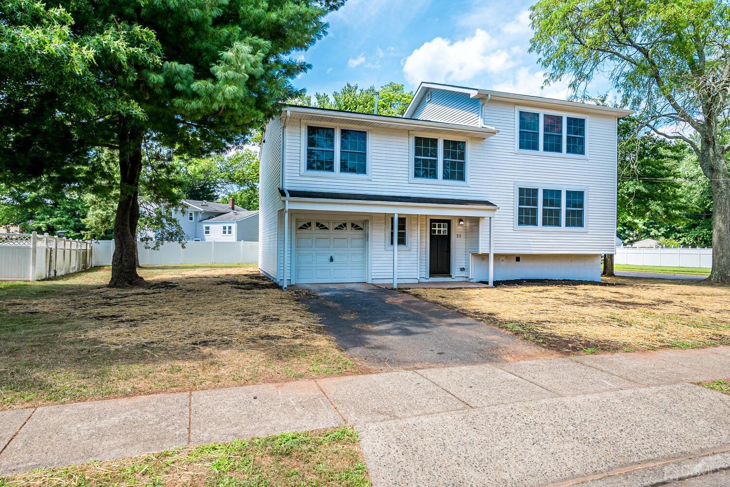 21 Brian Road Edison, NJ 08817 - Photo 2 of 47 a front view of a house with a yard