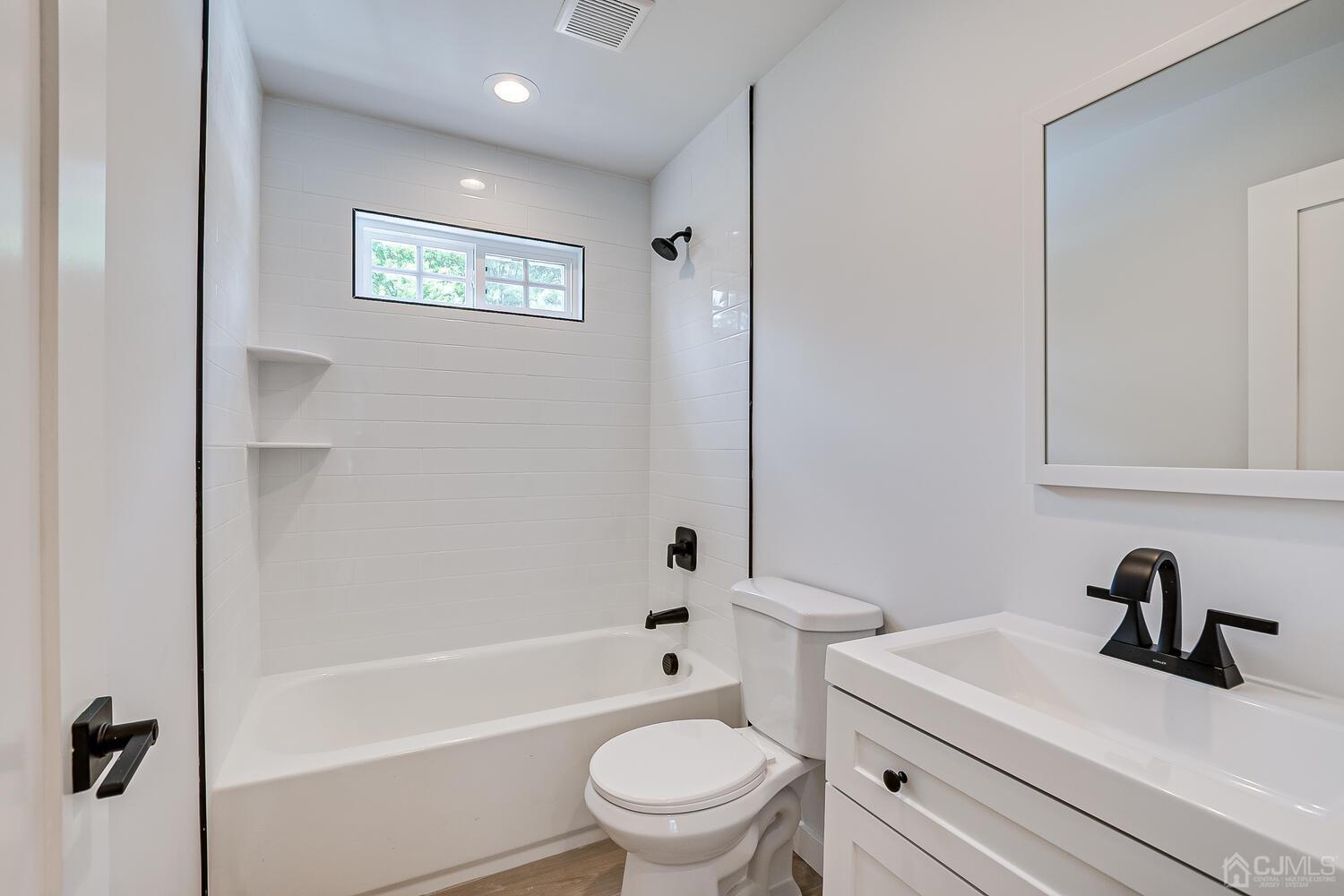 21 Brian Road Edison, NJ 08817 - Photo 41 of 47 a bathroom with a sink a toilet and a bathtub