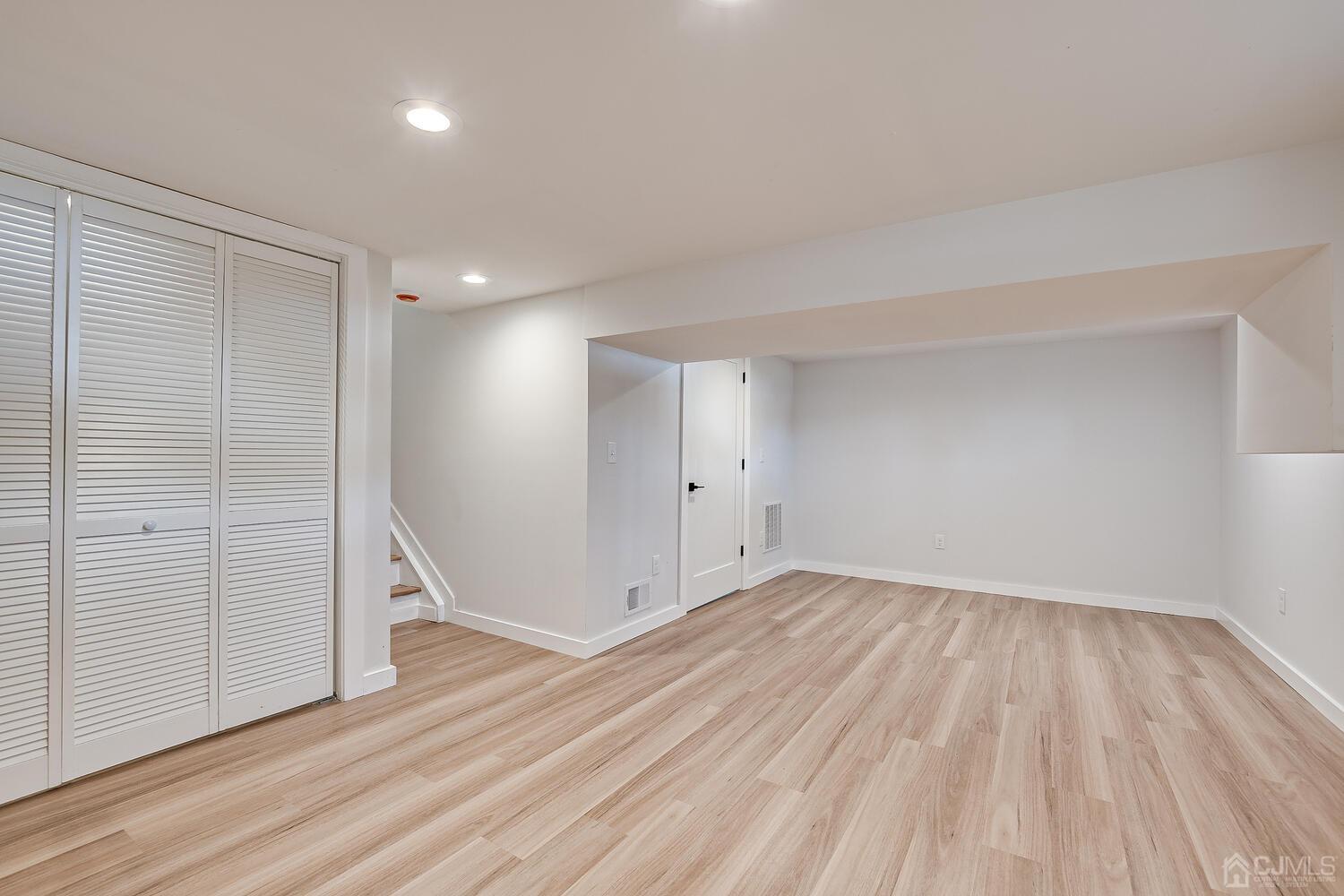 21 Brian Road Edison, NJ 08817 - Photo 43 of 47 wooden floor in an empty room with a window
