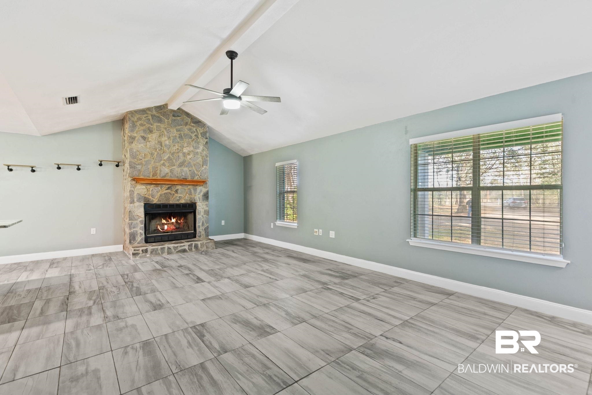 17366 Old Brady Road Bay Minette, AL 36507 - Photo 6 of 43 Unfurnished living room with a fireplace and a ceiling fan