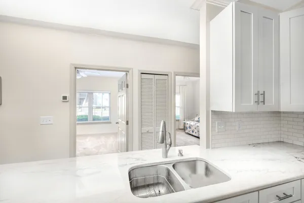 a kitchen with a sink and cabinets