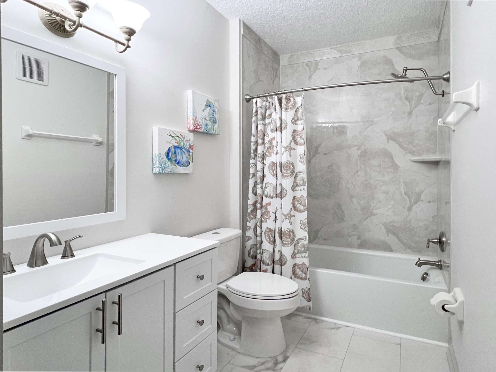 1601 Nectarine Street, Unit B2 Fernandina Beach, FL 32034 - Photo 18 of 46 a bathroom with a sink a toilet and a bathtub