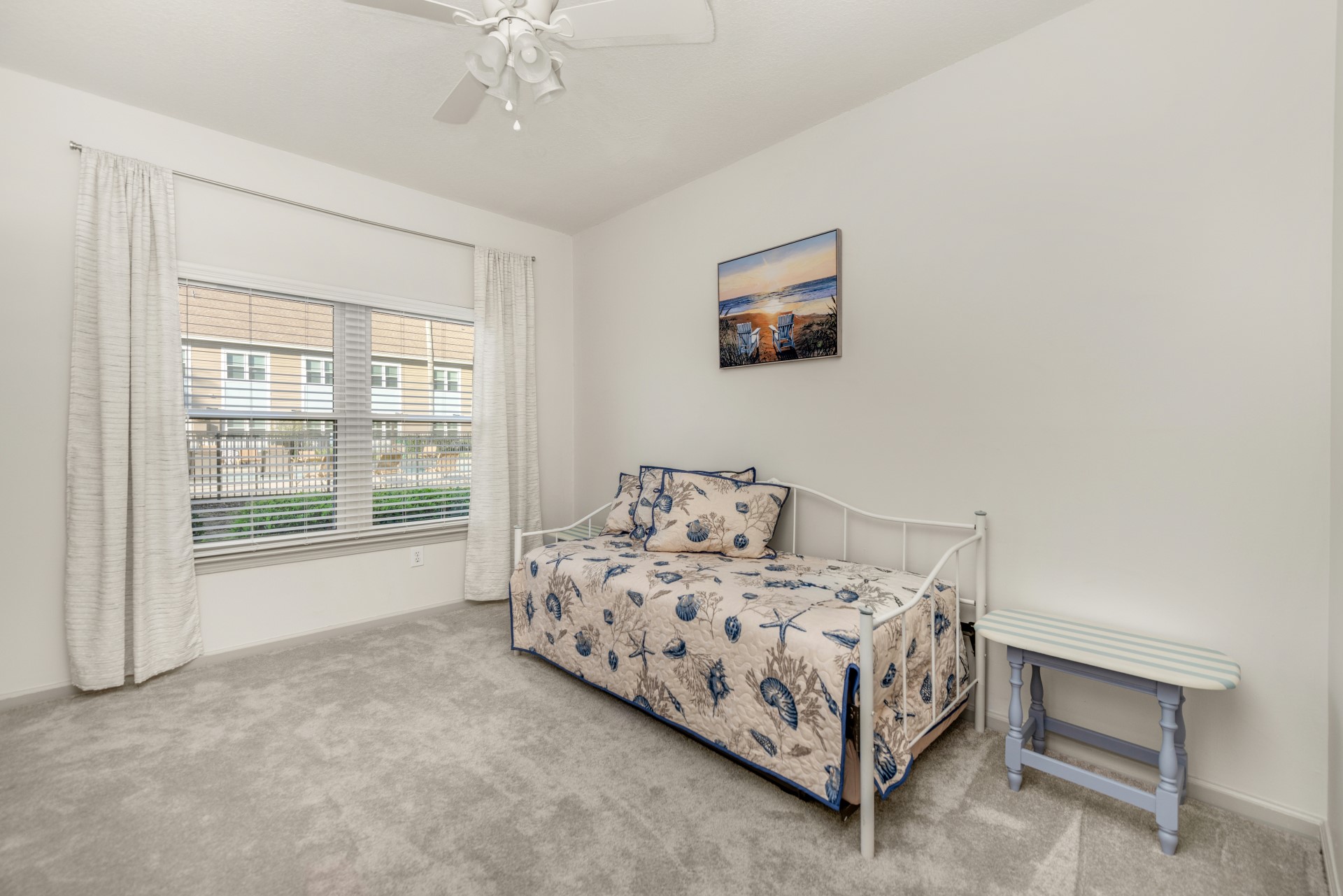 1601 Nectarine Street, Unit B2 Fernandina Beach, FL 32034 - Photo 19 of 46 a bedroom with a bed painting and a window