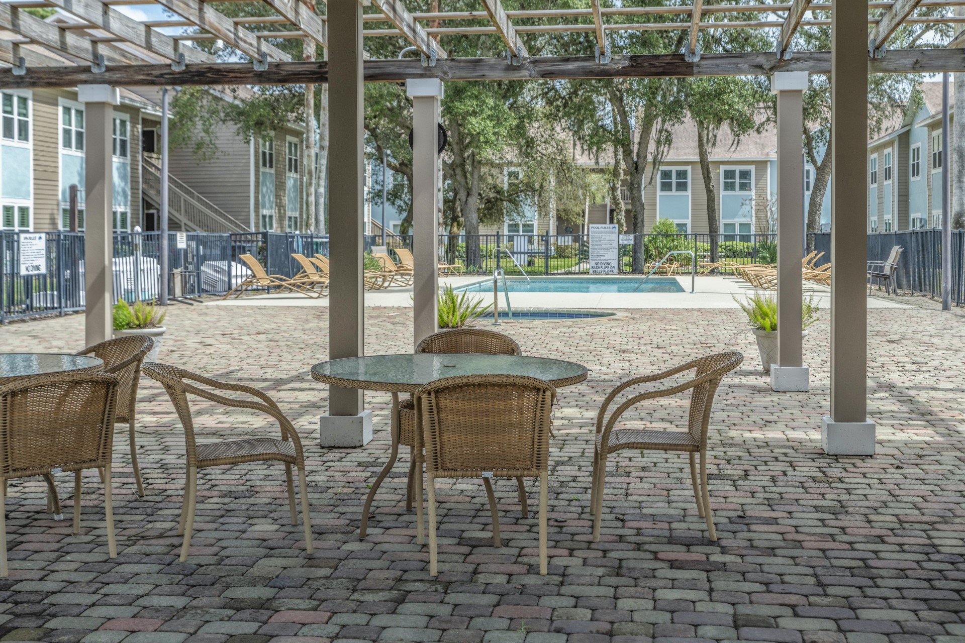 1601 Nectarine Street, Unit B2 Fernandina Beach, FL 32034 - Photo 28 of 46 a patio with yard glass top table and chairs