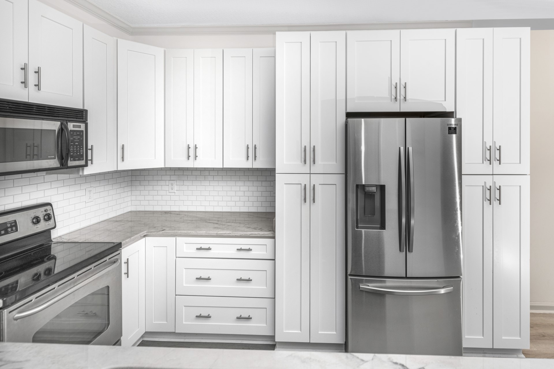 1601 Nectarine Street, Unit B2 Fernandina Beach, FL 32034 - Photo 3 of 46 a kitchen with appliances cabinets and a refrigerator