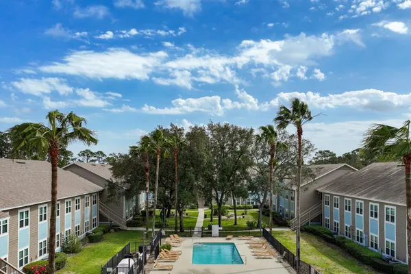 a view of a yard with furniture