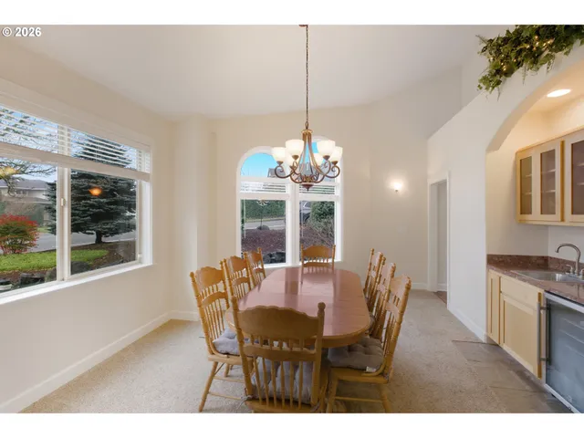 a view of a dining room with furniture window and outside view