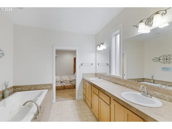 a bathroom with a granite countertop sink mirror and double