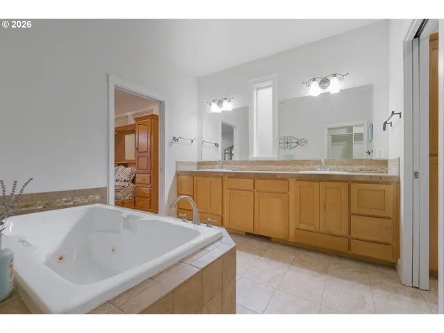 a kitchen with a sink a stove and cabinets