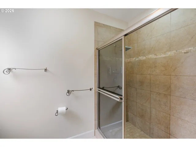 a bathroom with a shower and a sink