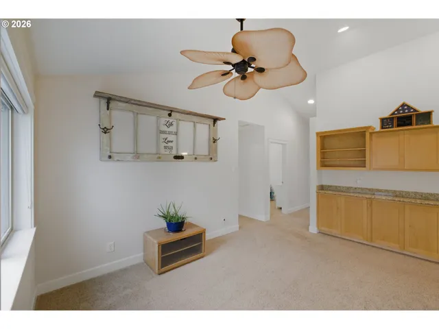 a view of a living room and a wooden floor