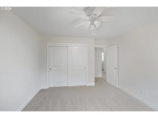 a living room with furniture and a gym equipment