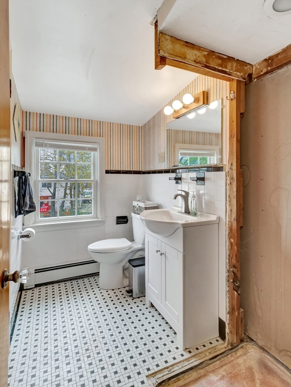 5 G Street Hull, MA 02045 - Photo 34 of 41 a bathroom with a sink a toilet and a shower