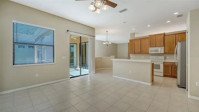 a kitchen with stainless steel appliances granite countertop a stove and cabinets