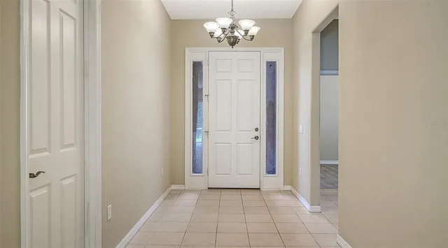 a kitchen with stainless steel appliances granite countertop a sink refrigerator and cabinets