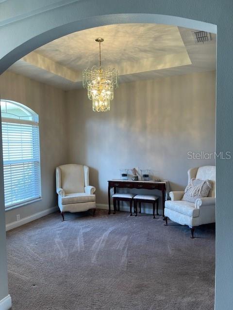 4493 Southwest 102nd Lane Road Ocala, FL 34476 - Photo 11 of 63 a living room with furniture and a chandelier